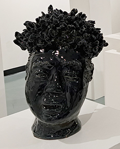 Image of the clay sculpture, Big Head by Harold Sanchez